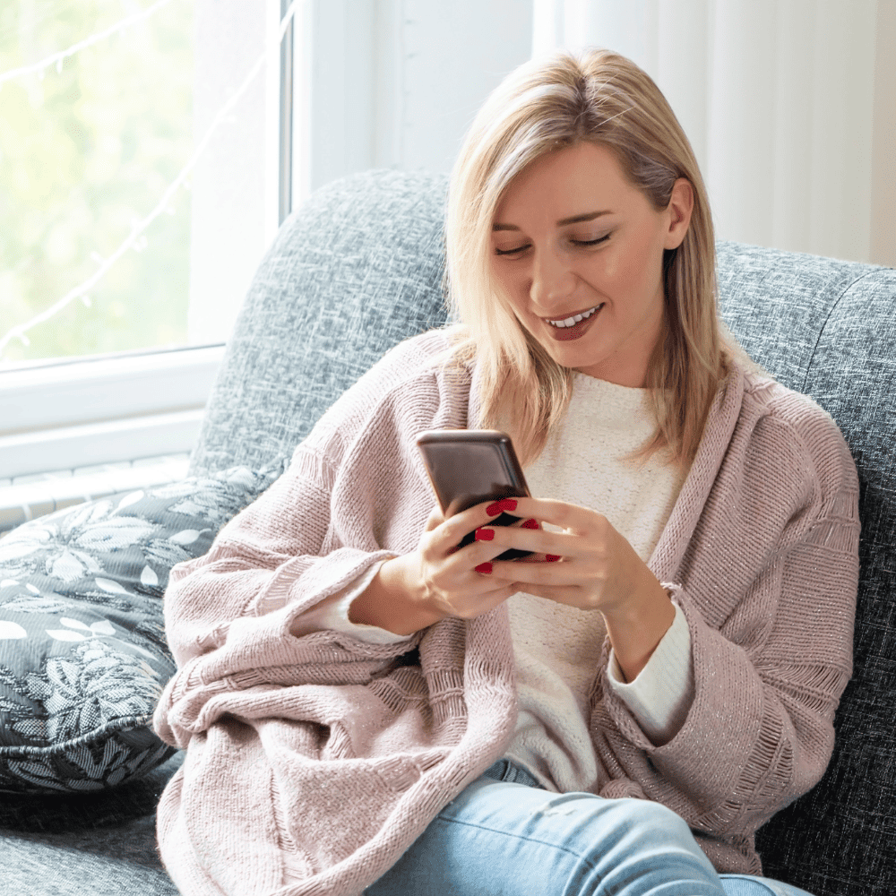 Woman on her phone booking a service