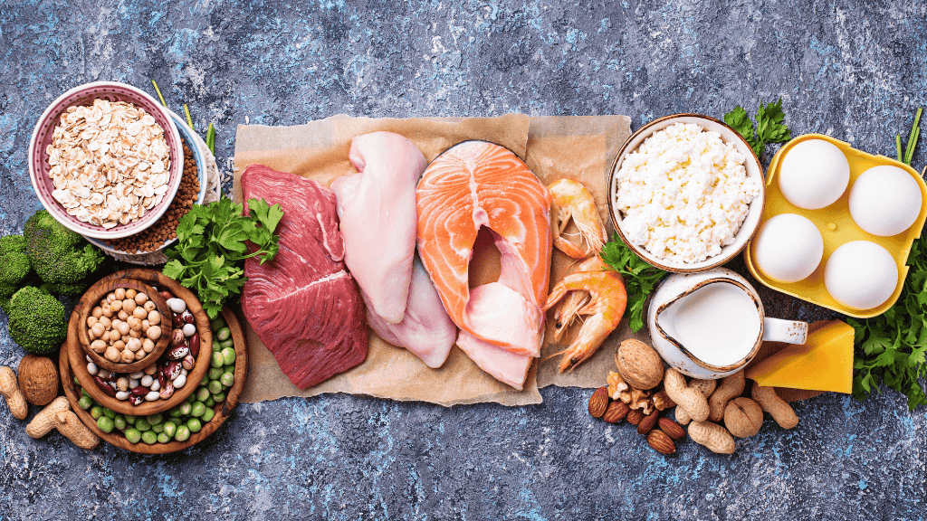 A variety of high-protein foods including meats, dairy, nuts, and legumes, essential for tissue repair and muscle maintenance.