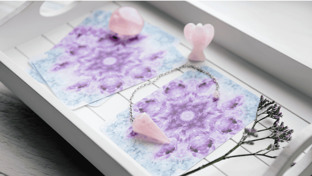 Healing crystals and mindful affirmation cards on a white tray.