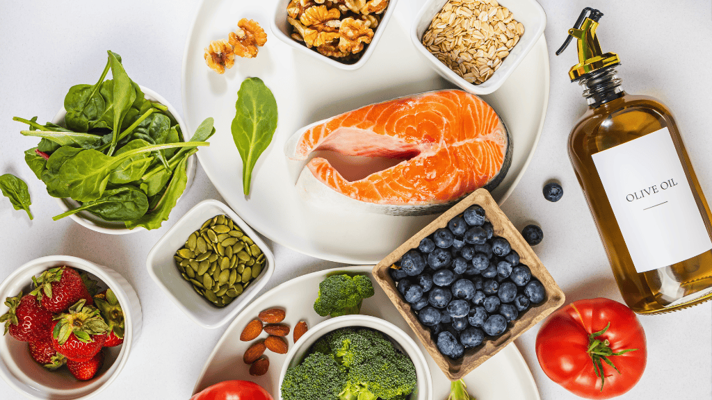 An assortment of nutrient-rich foods, including salmon, olive oil, blueberries, and vegetables, symbolizing the essence of balanced nutrition.