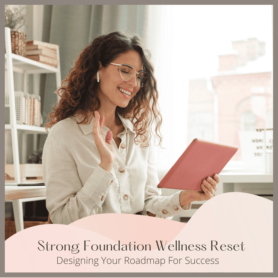 A smiling woman with curly hair and glasses waves at a tablet during a video call. Text reads: Strong Foundation Wellness Reset - Designing Your Roadmap For Success. About me: Jahlila Bastian.