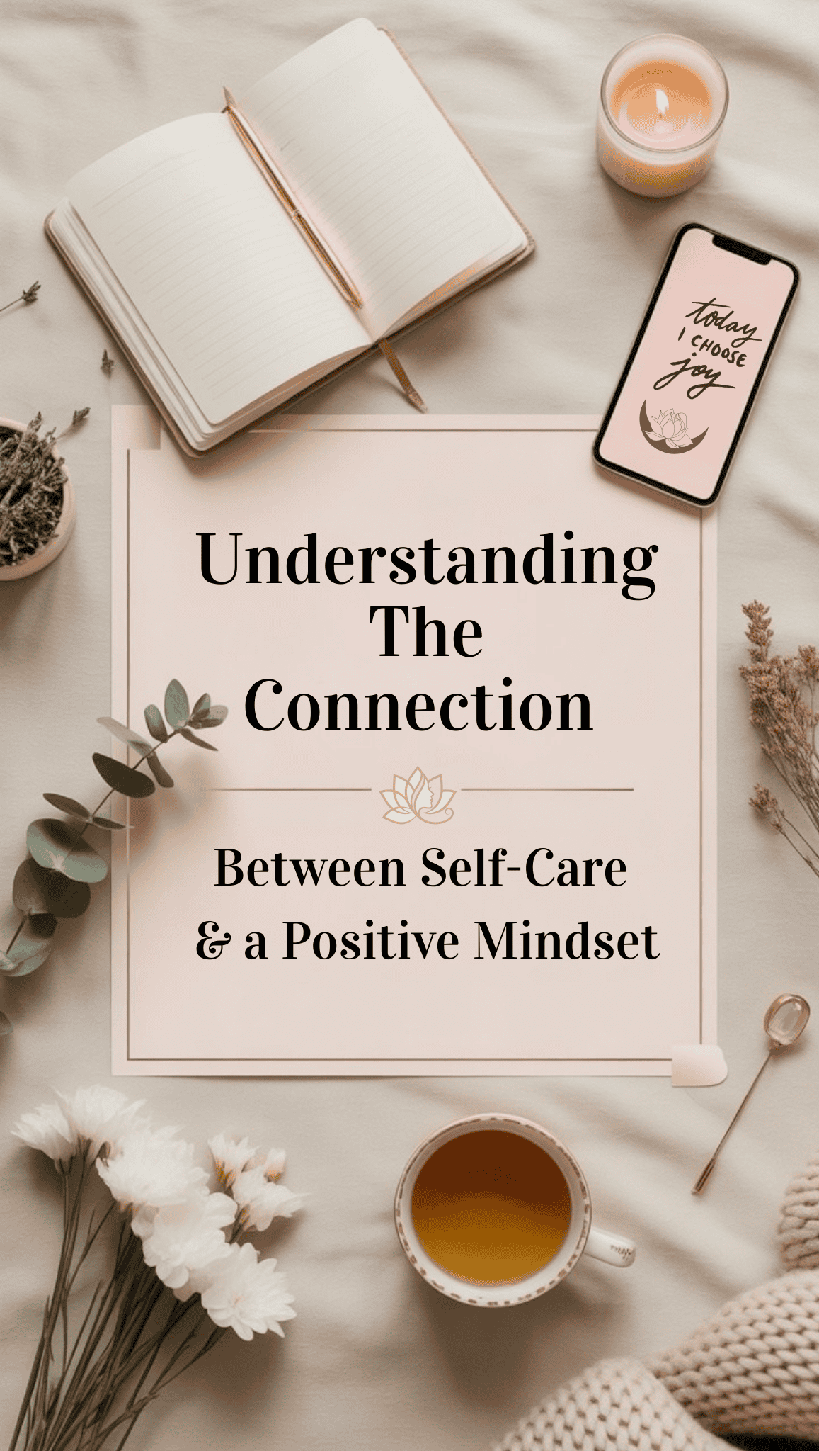 A flat lay featuring an open notebook, pen, candle, smartphone with “Think about you” on the screen, flowers, tea, and a card highlighting the link between self-care and a positive mindset.