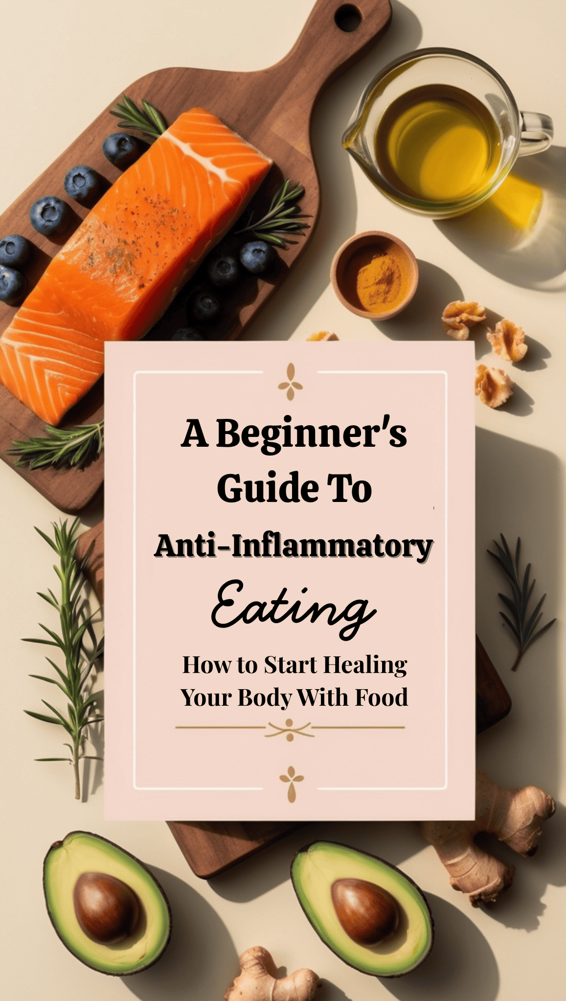 A flat lay of salmon, blueberries, rosemary, olive oil, ginger, and avocado surrounds a book titled A Beginner’s Guide to Anti-Inflammatory Eating: How to Start Healing Your Body with Food—perfect for anyone beginning their anti-inflammatory eating journey.